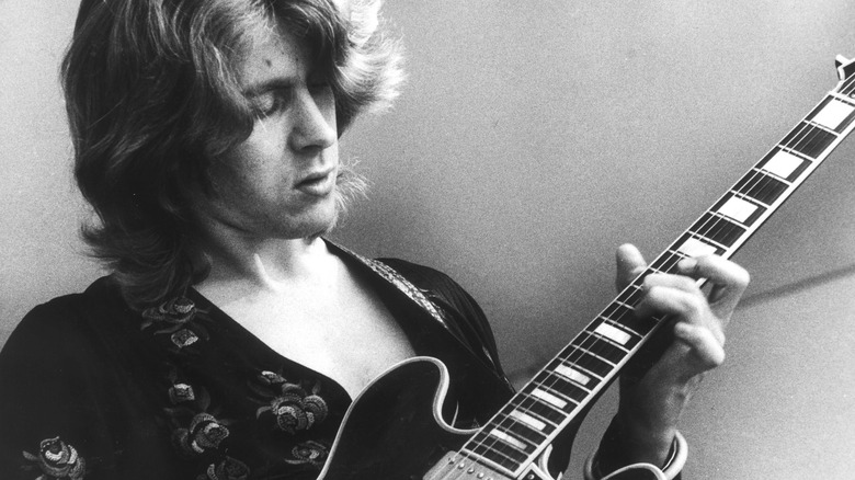 Mick Taylor on stage performing
