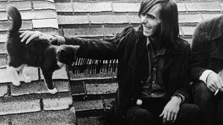 Nicky Hopkins petting a cat