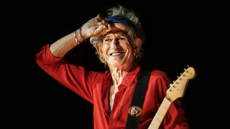 Keith Richards smiling with guitar