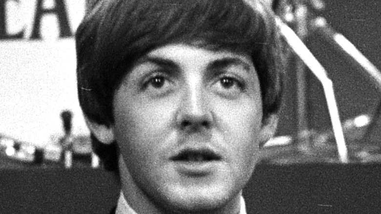 Young Paul McCartney mouth open