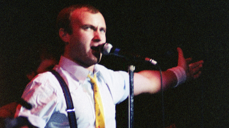 Phil Collins singing on stage