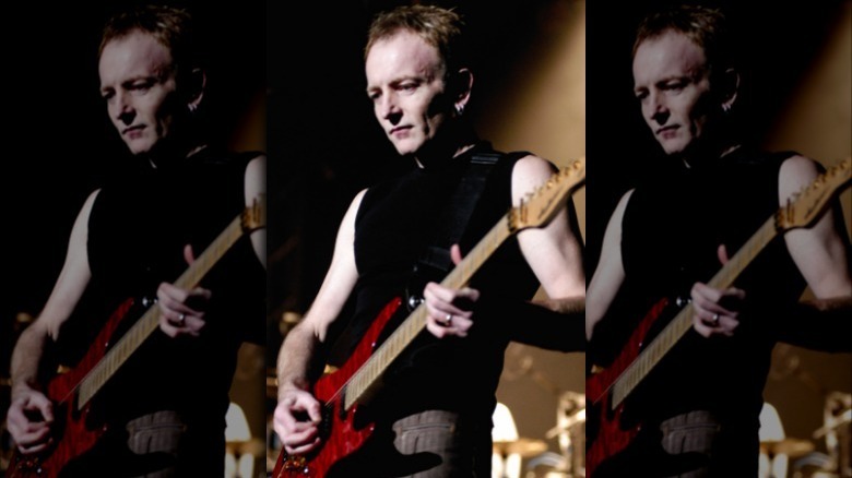 Phil Collen performing on stage