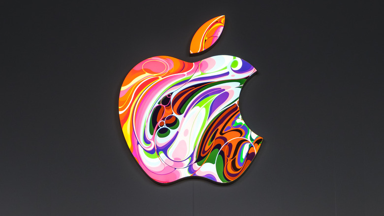 Colorful Apple logo on black wall