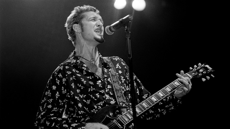 Layne Staley on stage with guitar