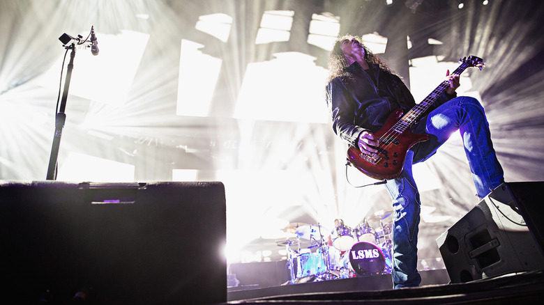 Mike Inez on stage with guitar Alice in Chains