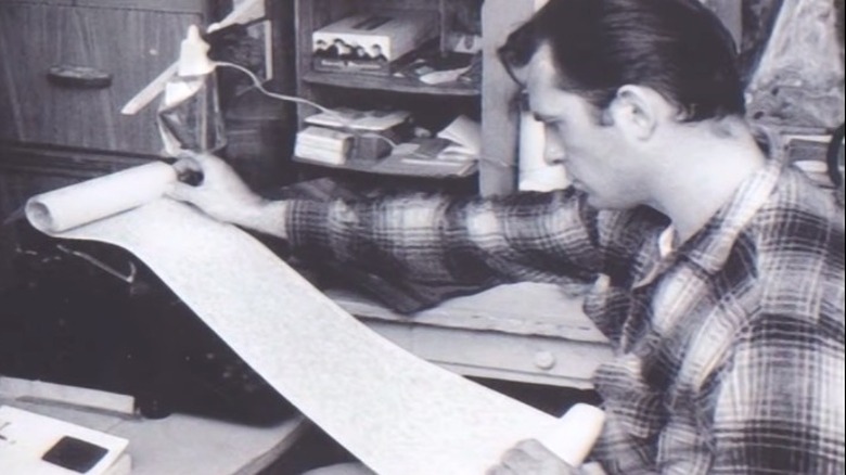 Jack Kerouac with portion of a scroll