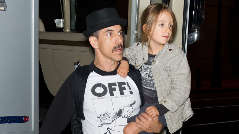 Anthony Kiedis carrying Everly Bear