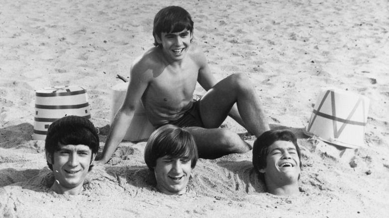The Monkees buried at the beach