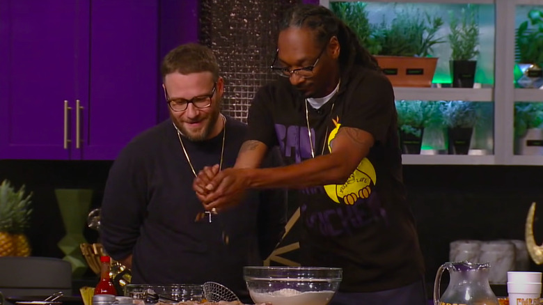 Snoop Dogg showing Seth Rogan how to cook