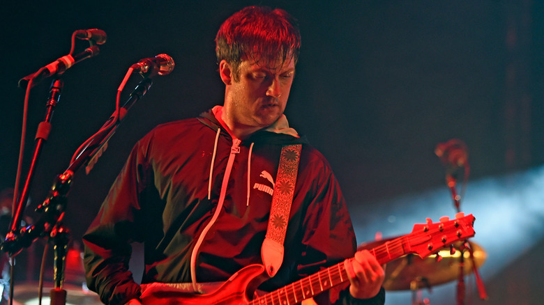 Isaac Brock playing guitar