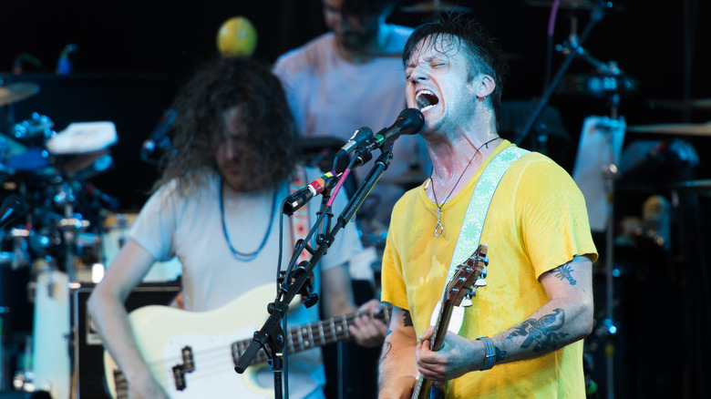 Isaac Brock yelling into a mic