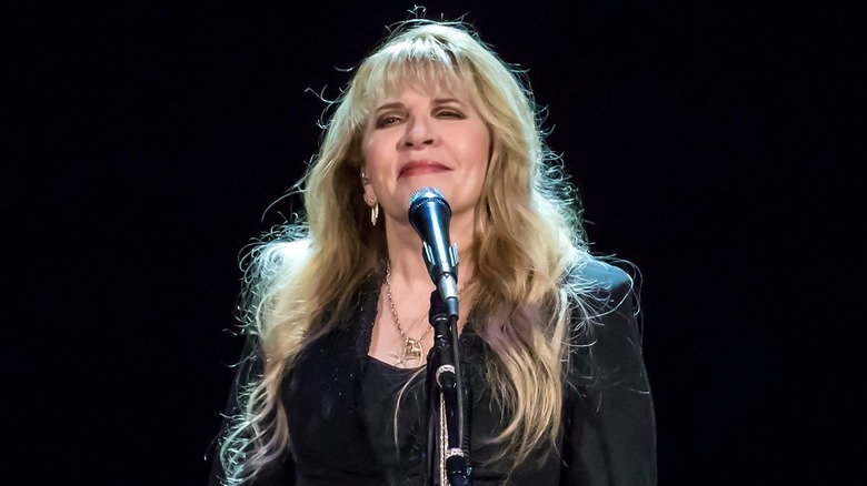 Stevie Nicks smiling at mic