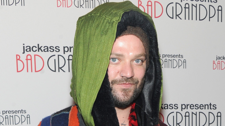 Bam Margera wearing green hood