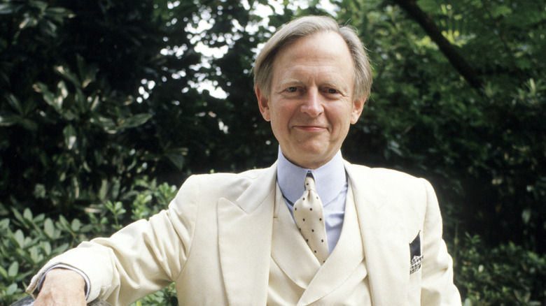 Author Tom Wolfe posing for a photo