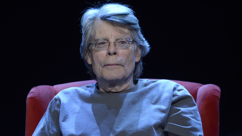 Stephen King posing for a portrait