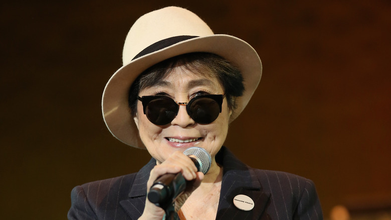 Yoko Ono smiling with mic