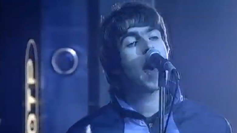 Screenshot of Oasis' Liam Gallagher performing Some Might Say on Top of the Pops in 1995