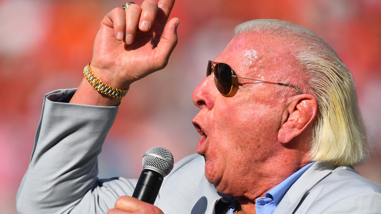 Ric Flair gesturing with microphone