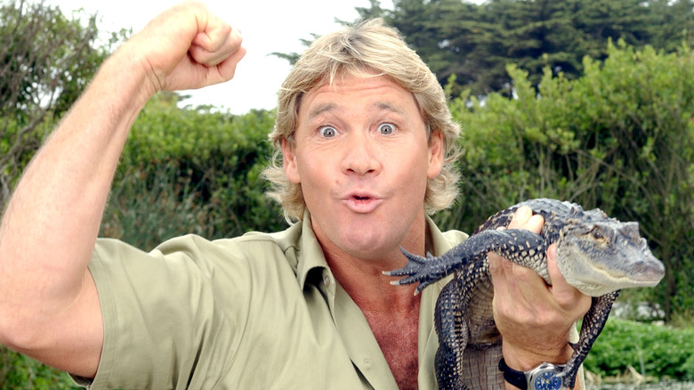 Steve Irwin holding small crocodile 