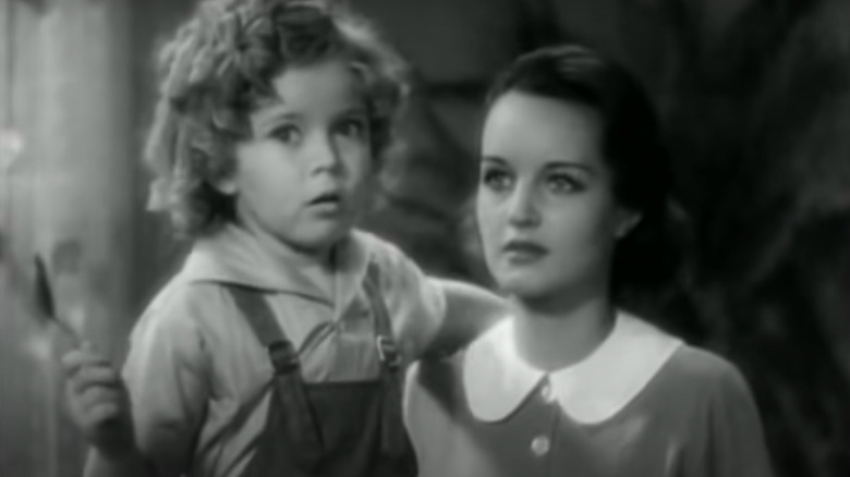 Shirley Temple holding a spoon in Curly Top