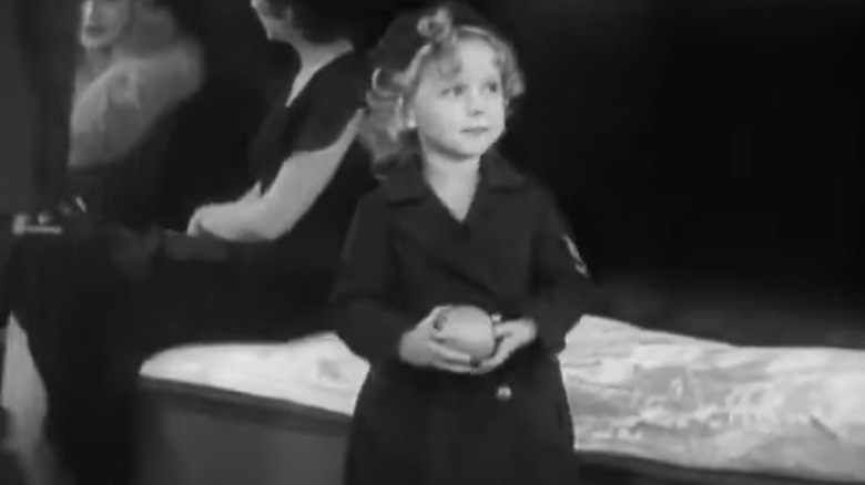 Shirley Temple holding ball