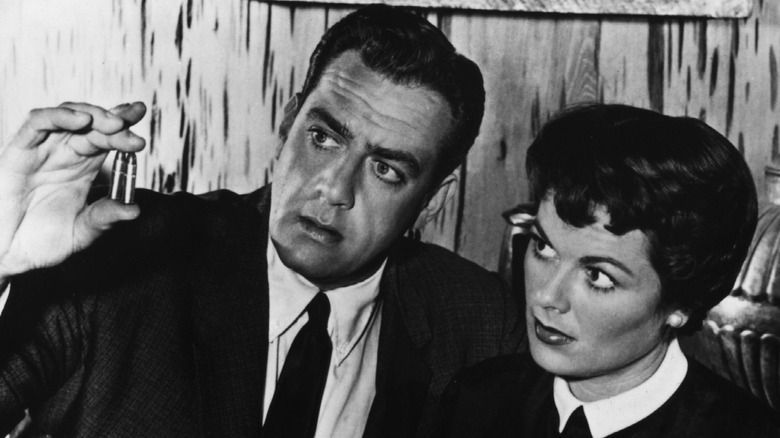 Perry Mason showing bullets to woman