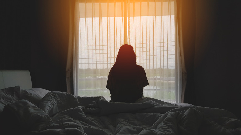 woman alone in hotel room