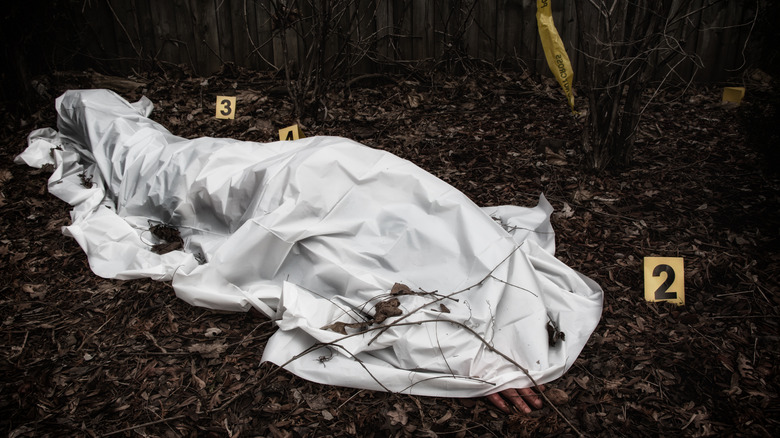 Dead body covered by sheet