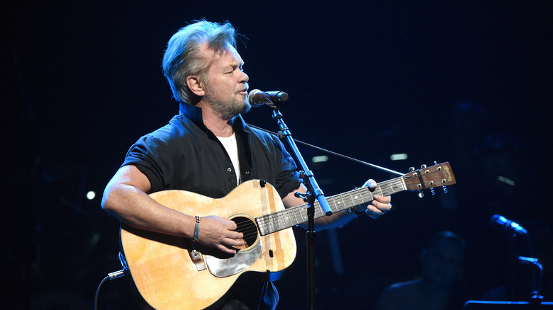 Mellencamp playing guitar