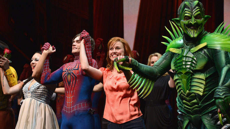 Spider-man musical cast holding hands