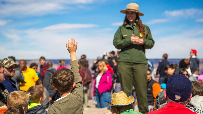 Grand Canyon, Arizona - March 21st 2014 - A park ranger replying to a kid's question in the south rim of the Grand Canyon National Park, Arizona, USA