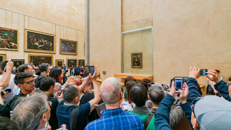 people admiring the Mona Lisa