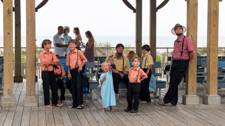 Mennonites on a stage at beach