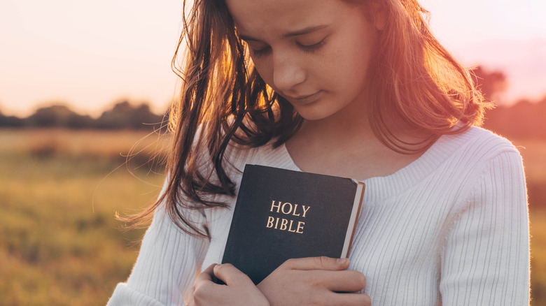 Woman holding a Bible