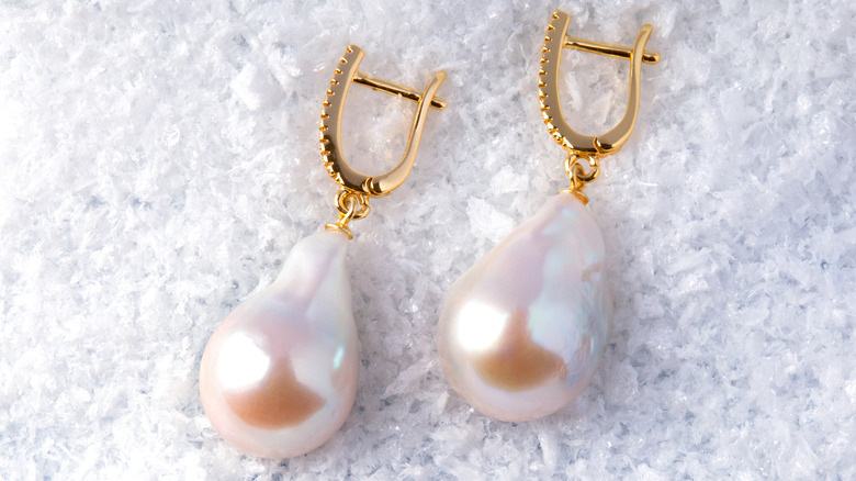 closeup of pearl earrings