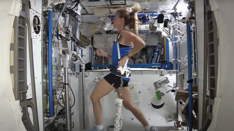 astronaut running on ISS treadmill