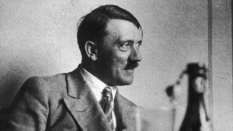 adolf hitler at a table