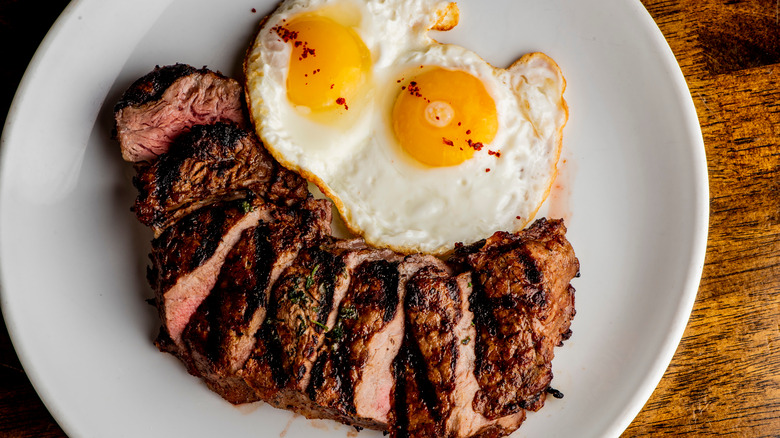 steak and eggs on a plate