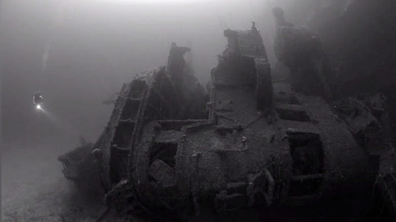 A diver approaching a shipwreck