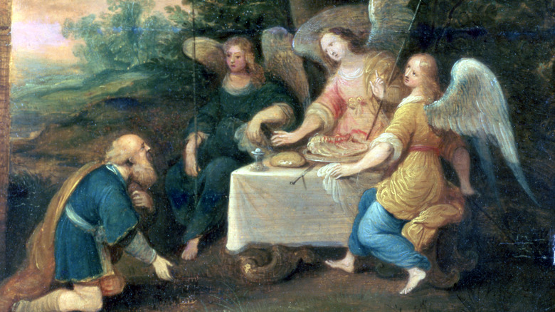 Abraham kneeling before three angels painting