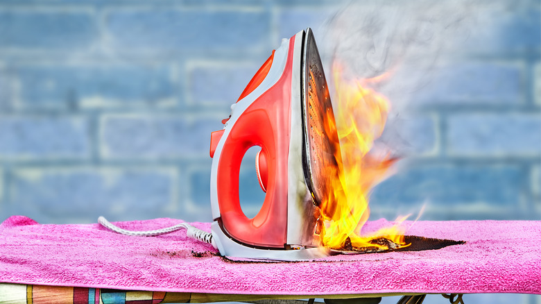Clothes iron on fire