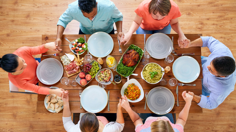 a family prays before eating