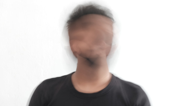 man with blurry unrecognizable face