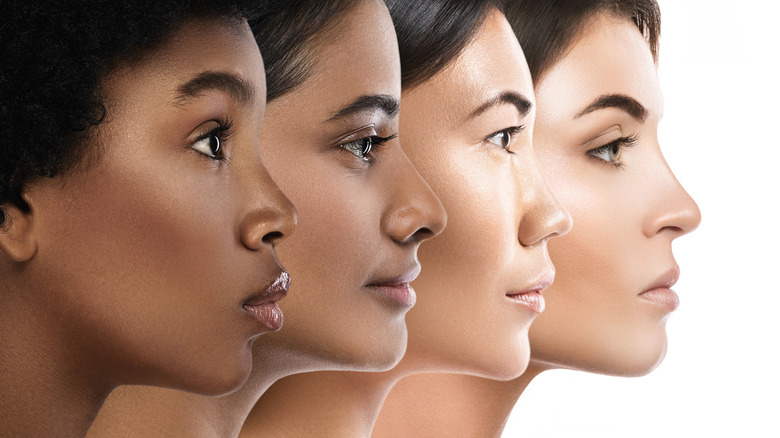 Four women in profile, different skin colors