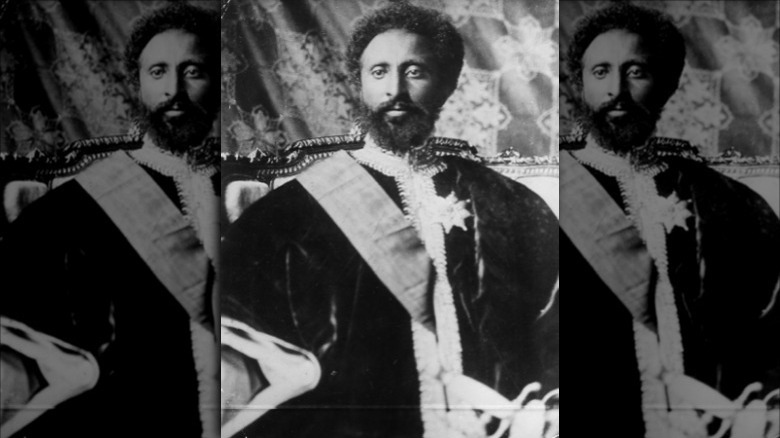 Haile Selassie posing for a photograph in imperial regalia