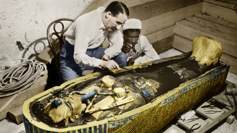 Archaeologists examining King Tut's sarcophagus in 1923