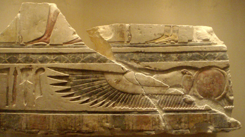 Winged Sun Disk and Diety Procession from the pyramid complex of Senwosret I in Lisht.