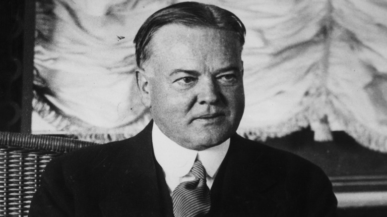 Herbert Hoover smirking