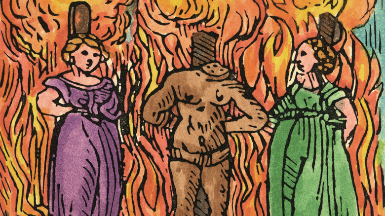 Witches and beheaded werewolf being burned at the stake illustration