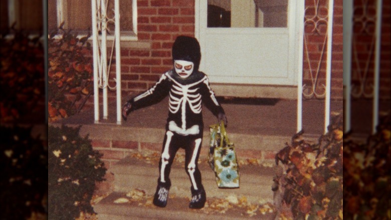 Halloween trick-or-treater, boy dressed as skeleton